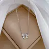 [Acero de titanio de cuerpo entero] estilo minimalista personalidad temperamento de lazo simple cadena de clavícula ins femenina de oro real en horno