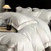 Conjunto premium de quatro peças em algodão de fibra longa com 200 fios, lençol de cima 100% algodão puro, lençol com elástico e capa de edredom, oferecendo uma experiência de cama luxuosa