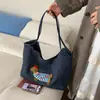 Nova Bolsa 2025 Feminina Retrô Jeans Tote Bag Grande Capacidade Carta Ombro Axila Bolsa de Trabalho Mamãe