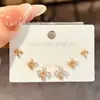 Traje de Aretes de Aguja de Plata S925 de Lujo Ligero Sentido de Grado Cobre Microincrustación Un Tarjeta Tres Pares de Aretes Elegantes Explosivos de Nicho para Mujeres