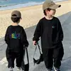 Camiseta de Manga Longa Infantil 2026 Novo Estilo Bebê Primavera Algodão Puro Camada Base Roupa Externa Desenho Animado Esportes para Meninos T