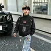 Ropa infantil para niños, nuevo estilo otoño 2026, gabardina infantil mediana y grande, chaqueta de moda para niños de secundaria