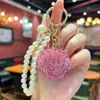 Chaveiro de Concha Dupla Face Mais Vendido Transfronteiriço com Strass Completo, Corrente de Pérolas Exquisite, Acessório de Decoração para Bolsa Feminina com Sensação de Alto Padrão