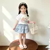 Conjunto de dos piezas de verano para niñas 2026, estilo coreano, moda nueva, versátil, de dibujos animados, manga corta, cuadros dulces, coreano, conjunto de moda