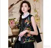 Coleção nova de 2026: roupas femininas modernas de estilo chinês, apresentando padrões étnicos, uma gola redonda retrô, coletes bordados e uma estética de luxo leve e de alta qualidade.