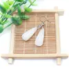 Venta al por mayor de fábrica aretes largos de cristal natural forma de gota de agua amatista Ojo de Tigre Joyería con gancho para la oreja aretes redondos de gota de agua DIY