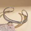 Pulsera Abierta Geométrica de Capas Cruzadas con Brillo Metálico Europea y Americana con un Toque Único Minimalista de Nicho de Alta Gama, Joyería Transfronteriza