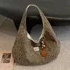 Bolsa de tela de gran capacidad para mujer otoño e invierno 2026 nueva bolsa de lona versátil bandolera estilo perezoso bolsa de mano para ir al trabajo