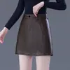 Pantalones cortos de mujer sencillos y elegantes 2026 otoño e invierno nueva tendencia ropa exterior pantalones de falda de cuero elegantes para la oficina pantalones de falda de pierna ancha línea A