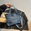 Bolso vaquero lavado con diseño patchwork único, alto valor estético, bolso de mano versátil para mujer, bolso de hombro casual para el día a día