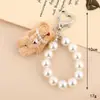 1PC 10cm Lindo Urso Coelho Pelúcia Enchido Chaveiro Pelúcia Pérola Chaveiro Decoração Acessórios Para Mochila Bolsa Carteira Chaveiro de Bolsa Estilo Luxo Branco/Rosa/Cáqui/Marrom