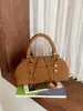 Bolso de mano, bolso tote pequeño, sensación de alta gama, versátil para ir al trabajo, bolso de hombro cruzado, nuevo bolso vintage para mujer Otoño e Invierno 2026, transfronterizo