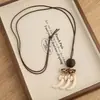 Nuevo Collar con Colgante Irregular Geométrico Estilo Chino y Borla para Mujer, Gama Alta, Personalizado, Versátil, Cadena para Suéter con Cordón de Cuero para Colgar en el Cuello