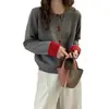 Nueva ropa de punto de lana pura para mujer de otoño e invierno, nuevo cárdigan abotonado de color bloqueado estilo chino, abrigo grueso holgado