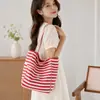 Nueva bolsa de lona de rayas de doble cara para mujer estilo coreano viento perezoso bolsa de mano de gran capacidad para clase y viaje bolsa de lona de mano