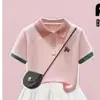 Camiseta de Manga Corta con Cuello Polo de Bloques de Color a la Moda para Niñas Verano Nuevo Estilo Dulce y Lindo Conjunto de Falda con Lazo