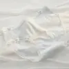 Calcinha feminina em jacquard com laço vazado, antibacteriana 10A, entrepernas alongada, cintura média de alta qualidade, modelagem justa ao quadril, ideal para adolescentes, estilo colegial.