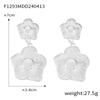 Europa y Estados Unidos venta caliente transfronteriza talla anillo aretes de flor hueca acero titanio chapado oro 18K aretes exagerados joyería mujer