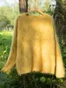 Nueva colección otoño/invierno 2026: Suéter de punto 100% cachemir puro para mujer con cuello redondo y un diseño texturizado cepillado, creando un efecto adelgazante y ofreciendo una sensación gruesa y cálida