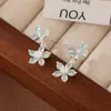 Nuevos Pendientes 2025 Zirconia Incrustada Pendientes de Flor y Mariposa Colgante Largo Fresco Accesible Lujo Bobina de Mosquito Clip para Oreja