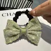Estilo Francés Elegante Lazo Cinta Encaje Brillante Pedrería para Mujeres Parte Trasera de la Cabeza Chongo Atado de Cabello a Mitad Recogido Accesorio para el Cabello