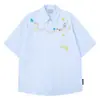 Camisa Xadrez Bordada com Gato e Cachorro Dopamina Floral Manga Curta para Homens e Mulheres 2026 Caimento Solto Camisa Top Preguiçosa