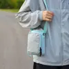 Bolsas de lona al por mayor para mujer, nuevo diseño de moda nicho verano 2026, bolso de hombro cruzado, estilo coreano popular, bolso para teléfono móvil