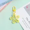 Novo Chaveiro de Flor Colorido Vazado Transparente Pingente de Joia DIY Versátil Criativo Charme para Bolsa Feminina