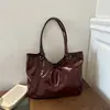 Bolso de Mano Retro Brillante Transfronterizo para Mujer Otoño/Invierno 2026 Nuevo Versátil Gran Capacidad para el Trabajo con un Solo Hombro Debajo del Brazo