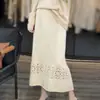 Falda de punto de lana completa de color liso con diseño calado de cintura alta para principios de otoño, línea A, suelta, adelgazante, elegante para ir al trabajo