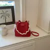 Bolso tipo cubo de alta apariencia 2026 Verano Nuevo de Moda Bolso Cruzado de Cadena Nicho Estilo Relajado Bolso de Mano de Color Sólido