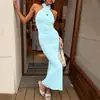 Top sin mangas halter con cuello cruzado y espalda descubierta, falda de corte sirena ajustada, conjunto de top sin mangas y falda larga estilo vacacional