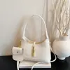 Bolsa pequena vintage de alta qualidade para mulheres, nova moda 2026, bolsa transversal versátil, bolsa de mão requintada e super popular, bolsa tipo balde