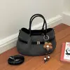 Bolso bandolera retro al por mayor 2026 para mujer, nuevo bolso tipo cubo de alta gama, bolso de hombro de moda para el día a día