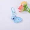 Llavero Colgante de Flor Geométrica de Resina con Cara Sonriente de Color Caramelo Forma de Corazón DIY Accesorio Creativo para Mochila Decoración