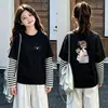 Camiseta de algodón a rayas de manga larga, estilo coreano y moderna, para niñas, un nuevo diseño de primavera/otoño, corte holgado, versátil y con cuello redondo, adecuada para niños de talla mediana a grande