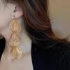 Aretes de borla de flor hueca de circón súper hada temperamento aguja de plata aretes comodín aretes de ambiente exagerado europeo y americano al por mayor