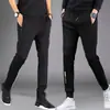 Pantalones casuales gruesos para hombre de primavera y otoño, joggers deportivos holgados de cintura alta de corte slim versátiles con cremallera y perneras rectas