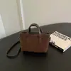 Bolso cubo retro para mujer 2026 nuevo bolso de mano de moda tipo cesta bolso de hombro de color liso bolso cruzado de alto valor