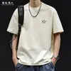Camiseta Estampada de Marca Tendência Manga Curta para Homens, Tamanho Grande Solta Roupa Novo Estilo Verão 2026, Camiseta Masculina Versátil de Alta Qualidade