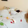 Bordado de toalla de dibujos animados de grado A, con un juego de cuatro piezas cepillado de algodón de fibra larga de Xinjiang 100s, perfecto para otoño e invierno, con un diseño amigable con la piel y cómodo, adecuado para ropa de cama infantil