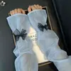 Elegantes mangas de protección solar de hilo perlado con lazo para mujer, verano, estilo INS, mangas de seda helada, protección para los brazos a prueba de viento, mangas de campana