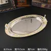 Bandeja metálica ovalada de estilo europeo con motivos florales de colores esmaltados, adecuada para servir fruta, como bandeja de té en hoteles, o para guardar frutos secos.; una pieza decorativa para la decoración del hogar