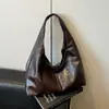 Nova bolsa de ombro de comércio exterior, bolsa de ombro com textura de moda em PU, bolsa feminina versátil retrô europeia e americana de grande capacidade para o dia a dia, transfronteiriça