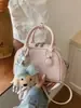 Bolso pequeño de estilo fresco transfronterizo para mujer, nuevo modelo 2026, bolso de hombro y cruzado para el trabajo, bolso tipo bowling moderno y a la moda para mujer