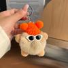 Lindo colgante de bolsa de bola de carbón pequeña de piel de conejo Rex, mochila escolar, muñeco feo, llavero de coche de muñeca de dibujos animados.