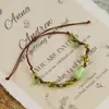 Jingdezhen Navidad Pulsera de Cuerda Trenzada de Cerámica Pulsera de Trébol de Cuatro Hojas Joyería Artística Hecha a Mano Venta al por Mayor Pulseras de Cerámica para Atracciones Turísticas