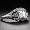 Anel Zhenrong ebay mais vendido com topázio azul incrustado Anel de noivado criativo de todas as flores com diamantes simulados para mulheres europeias e americanas