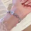 Nuevo brazalete personalizado de moda de verano europeo y americano, elegante y fresco brazalete floral, joyería de circonita de nicho para mujeres al por mayor