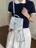 Mochila Casual Yuezi de Nicho com Laço para Mulheres 2026 Novo Modelo Estilo Universitário Mochila Escolar Fofa Mochila de Viagem